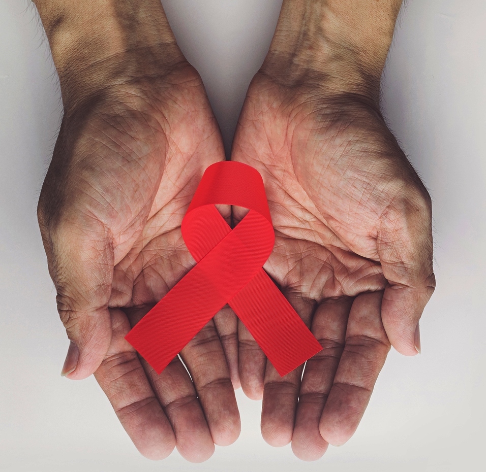 Man Holding Red Aids Ribbon, Hiv/aids And Aging Awareness Month Concept