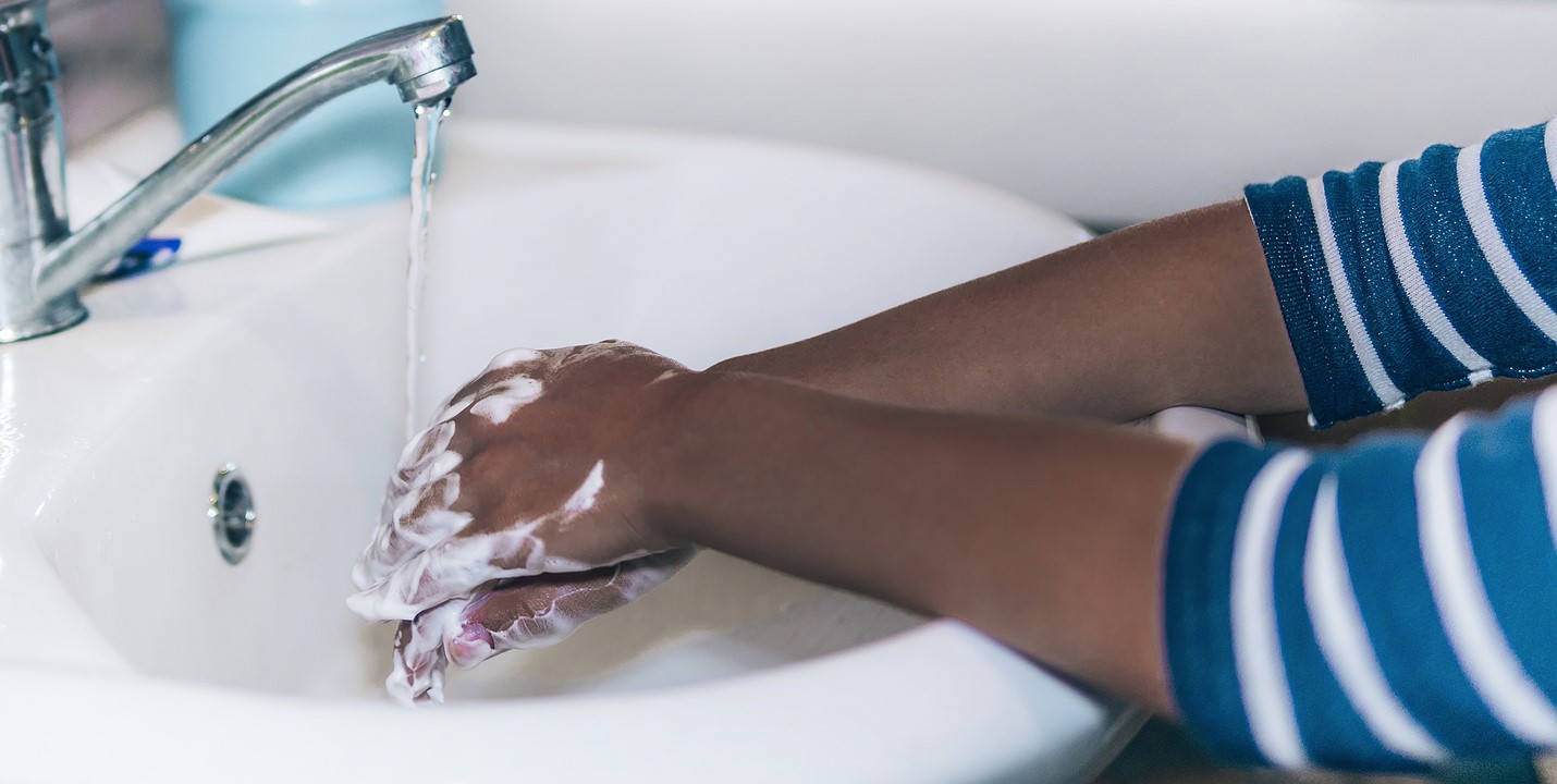 Black-child-washing-hands